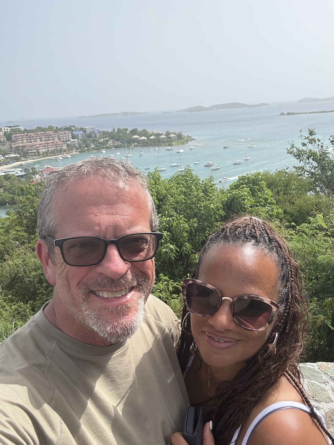 Jay Simmons and his wife overlooking a coastal bay